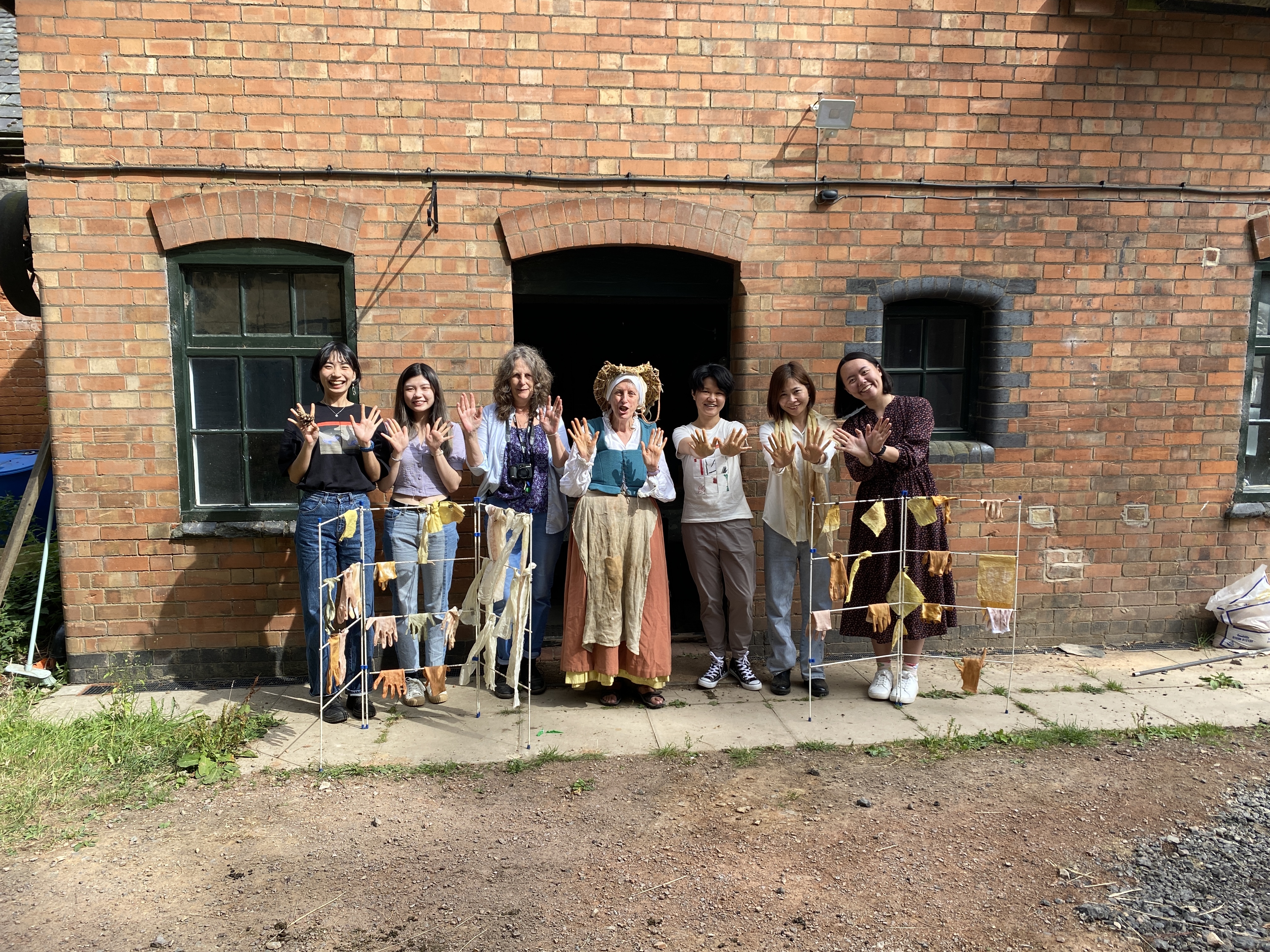 Vanessa Parkinson (in the middle), a Tudor plant specialist, dressed as a Tudor gardener, leading a natural dyeing workshop.