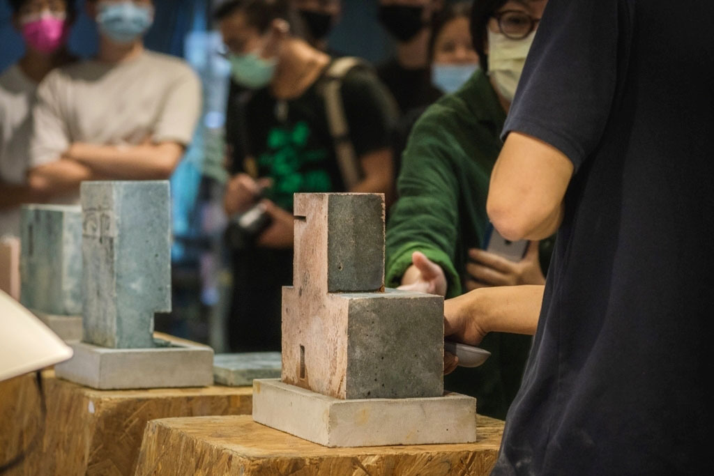 “Yu-Di-Yi-Jan” combines fly ash, the remainder of the geothermal energy generation, with local laterite, black slate, serpentinite, and blue dye powder to make sustainable ready-mixed concrete.