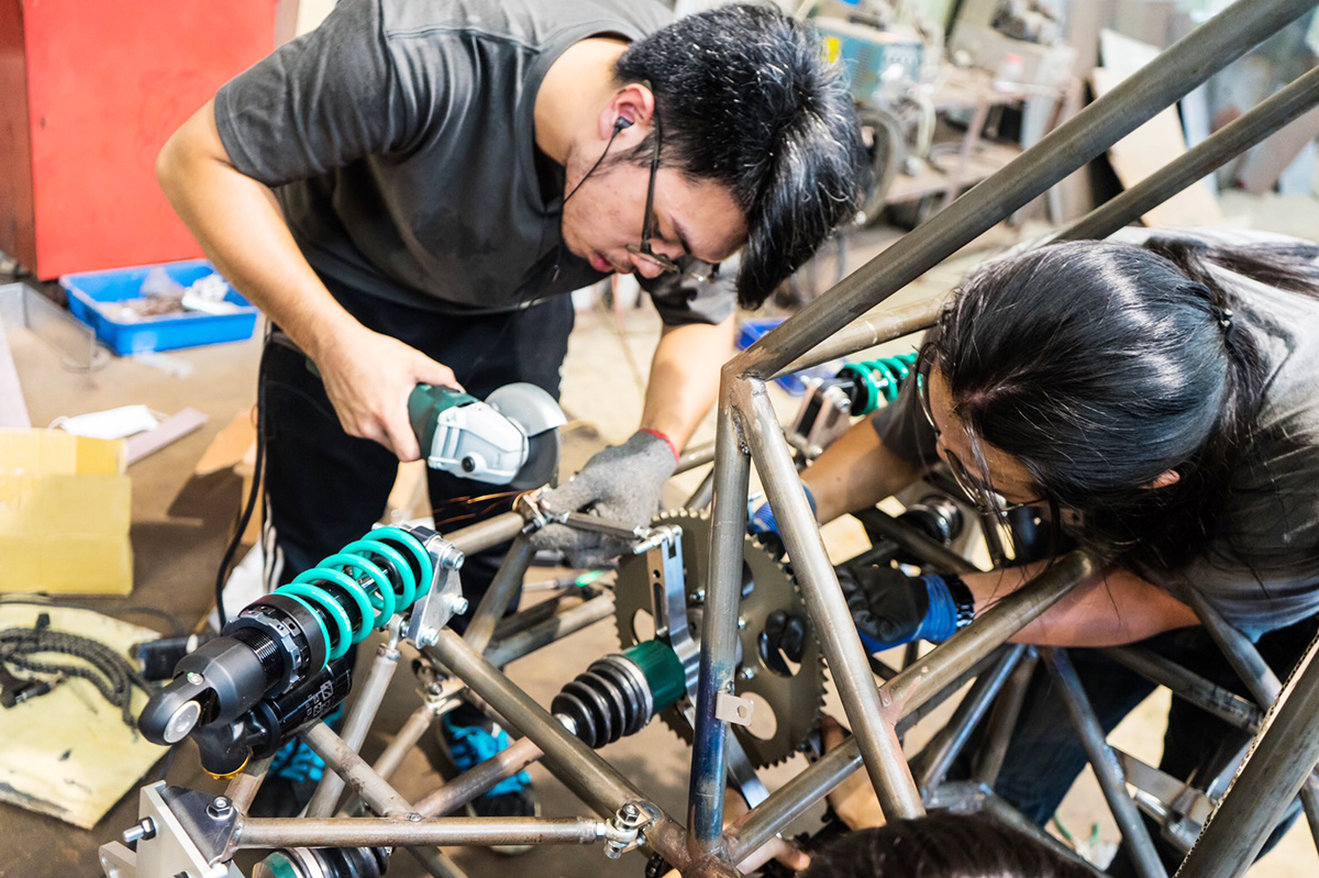 Teams are also required to submit design, cost analysis, and business reports, forcing each team to work across disciplines